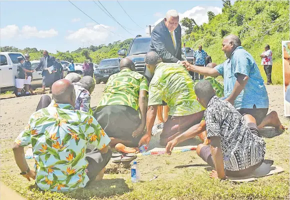  ?? Picture: ELIKI NUKUTABU ?? Prime Minister Voreqe Bainimaram­a shake hands
with Namara villagers during his arrival for the Tailevu Provincial Council meeting in Namara, Tailevu yesterday.