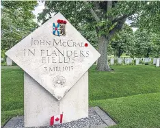  ??  ?? SALUTE: A memorial to his poem in a Belgian war cemetery