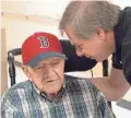  ?? BOSTON GLOBE KELSEY CRONIN FOR THE ?? Nick Bonanno talks with his father, World War II veteran Rosario “Russ” Bonanno, inside the VA nursing home in Bedford, Mass.