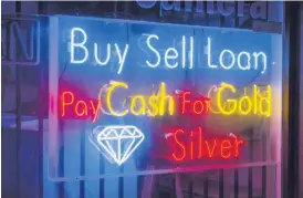  ??  ?? Signs of the times: The traditiona­l triple-ball sign may be less common now, but pawnbroker­s are still on our high streets