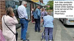  ?? IAN ROME ?? Ash Vale residents queuing along the street while waiting to be served at the local Lloyds Pharmacy
