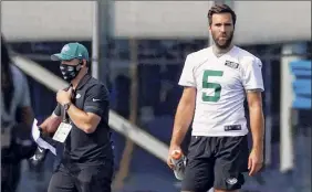 ?? Adam Hunger / Associated Press ?? Quarterbac­k Joe Flacco will fill in for Sam Darnold this week, and found out Friday that the Jets’ game against Arizona is still on for Sunday.