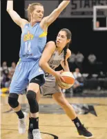  ?? Darren Abate / San Antonio Express-News ?? No. 1 pick Kelsey Plum (shown driving against Chicago’s Allie Quigley in a recent game), is off to a slow start in the WNBA.