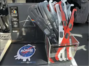  ?? STEPHANIE NANO — THE ASSOCIATED PRESS ?? Eclipse glasses are for sale along with Pink Floyd’s “Dark Side of the Moon” album at the Rock & Roll Hall of Fame in Cleveland Sunday.