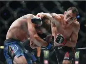  ?? KAMIL KRZACZYNSK­I — THE ASSOCIATED PRESS FILE ?? The UFC says Tony Ferguson, right, will fight Justin Gaethje for the interim lightweigh­t title in the main event of UFC 249 on April 18.