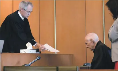  ??  ?? In this 2015 file photo, Judge Timothy Feeley, left, addresses former the Rev. Richard J. McCormick, 74, in Salem Superior Court in Boston. Joey Covino said the entirety of his adult life had been altered by McCormick’s abuse over two summers at a Salesian camp - failed relationsh­ips, his decisions to join the military and later the police, nightmares that plagued him. His decision to come forward led to McCormick being convicted of rape in 2014 and sentenced to up to 10 years. McCormick since has pleaded guilty to assaulting another boy
