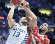  ?? Andy Lyons Getty Images ?? ISAIAH BRISCOE of Kentucky tries to get a shot off against Arlando Cook of Arkansas.