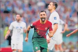  ?? AFP ?? Portugal's Bruno Fernandes celebrates after scoring against Uruguay on Monday.