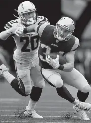  ?? AP/MICHAEL DWYER ?? Rex Burkhead (34) caught seven passes for 68 yards in the Patriots’ 21-13 victory over the Los Angeles Chargers on Sunday in Foxborough, Mass.