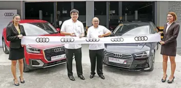  ??  ?? Audi Philippine­s Head Benedicto Coyiuto and Corporate Affairs Director Amado del Rosario at the ceremonial ribbon-cutting