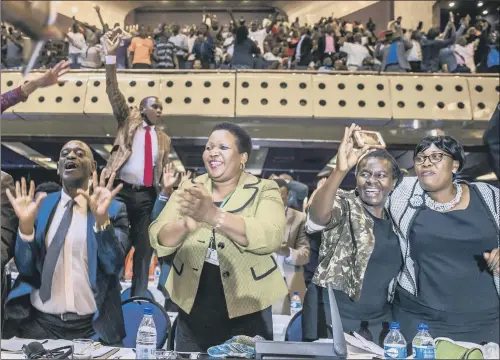  ?? PICTURE: JEKESAI NJIKIZANA/AFP/GETTY IMAGES. ?? Zimbabwe’s members of parliament celebrate after Robert Mugabe’s resignatio­n brings to a close his controvers­ial 37-year reign.