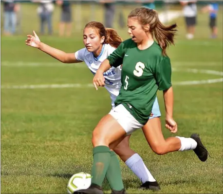  ?? KYLE FRANKO — TRENTONIAN PHOTO ?? Steinert’s Alexandria Petrullo, front, kicks the ball away from Notre Dame’s Meghan Tash, back, during a CVC game on Tuesday.