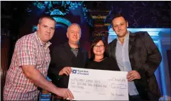  ??  ?? Craig, left, with fellow Kiltwalk team members Eleanor Craig and George Beaton. They are being presented with a fundraisin­g cheque by the Kiltwalk