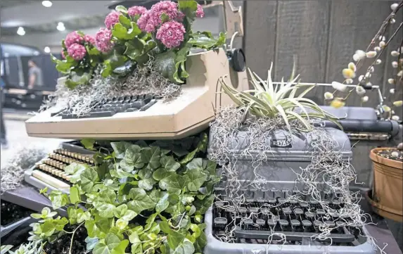  ?? Antonella Crescimben­i/Post-Gazette ?? The Bidwell Training Center and its sister organizati­on, Manchester Craftsmen's Guild, set up their displays for the Home Garden Show on Wednesday at the David L. Lawrence Convention Center.