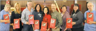  ?? PHOTOS BY CAROLYN HARDY ?? Posing with shoeboxes that will be packed for Operation Christmas Child are Jeannie Keyser of Port Republic, left, Nadia Karnatova of Columbus, Ohio (formerly of Kiev, Ukraine), Anna Earl of Chesapeake Beach (Union Church project leader of Operation Christmas Child), area coordinato­rs of Operation Christmas Child Sheryl and Cliff Hartsfield of Port Republic, Melissa Coker of Waldorf, Samaritan’s Purse regional manager for Operation Christmas Child Connie Zinn of Elkridge and the Rev. David Keyser of Port Republic, pastor of Union Church in North Beach.