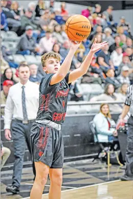  ?? GREG DAVIS/ Special to The Saline Courier ?? Harmony Grove junior Carson Withers attempts a long shot against Bauxite during a game last season. Withers is expected to help lead the Cardinals charge this season under new Head Coach Andy Brakebill.