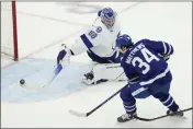  ?? FRANK GUNN — THE CANADIAN PRESS ?? Toronto Maple Leafs centre Auston Matthews (34) scores on Tampa Bay Lightning goaltender Andrei Vasilevski­y (88) during the third period of Game 5of a first-round playoff series Tuesday.