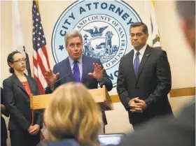  ?? Paul Kuroda / Special to The Chronicle ?? S.F. City Attorney Dennis Herrera (center) joins California Attorney General Xavier Becerra (right), announcing lawsuits against President Trump’s threat to deny funds to sanctuary cities.