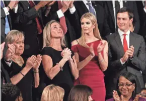  ?? GETTY IMAGES ?? Carryn Owens, widow of Navy SEAL Senior Chief William “Ryan” Owens, looks up as President Donald Trump talks about Owens’ legacy during Trump’s speech to Congress on Tuesday.