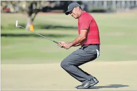  ?? ORLANDO SENTINEL FILE PHOTO ?? Tiger Woods grimmaces after missing a putt on the 15th green during the Arnold Palmer Invitation­al on March 18.