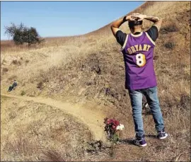 ?? Al Seib Los Angeles Times ?? ANTHONY CALDERON, 33, of West Hills stands in the Calabasas hills where Bryant’s helicopter crashed, killing him, daughter Gianna and seven others.