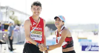  ?? ?? Turkish athletes Salih Korkmaz (L) and Meryem Bekmez celebrate after securing the 2024 Paris Olympics, Antalya, Türkiye, April 21, 2024.