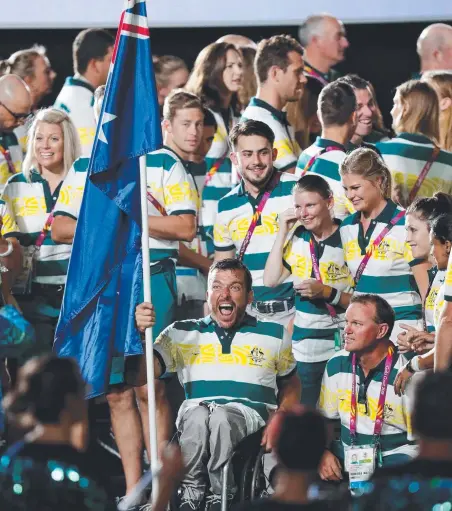  ?? Picture: MICHAEL WILLSON ?? Australian flagbearer Kurt Fearnley and teammates at the closing ceremony.