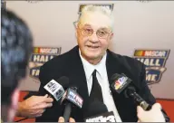  ?? Bob Leverone / Associated Press ?? Engine builder Maurice Petty answers reporters’ questions on his way to the NASCAR Hall of Fame induction ceremony on Jan. 29, 2014, in Charlotte, N. C. Petty joined his brother Richard Petty in the hall. Maurice Petty died on Saturday. He was 81.