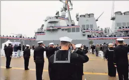  ?? Jonathon Gruenke / TNS ?? Sailors salute during a remembranc­e ceremony on Monday morning commentati­ng the 20th anniversar­y of the attack on USS Cole.