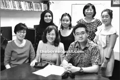  ??  ?? Law-Lee (seated centre) together with the Society of Profession­al Musician of Kuching committee members posing for group picture.