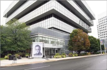  ?? Tyler Sizemore / Hearst Connecticu­t Media ?? A curtain depicting bankruptcy Judge Robert Drain is displayed outside Purdue Pharma headquarte­rs in Stamford on Wednesday.