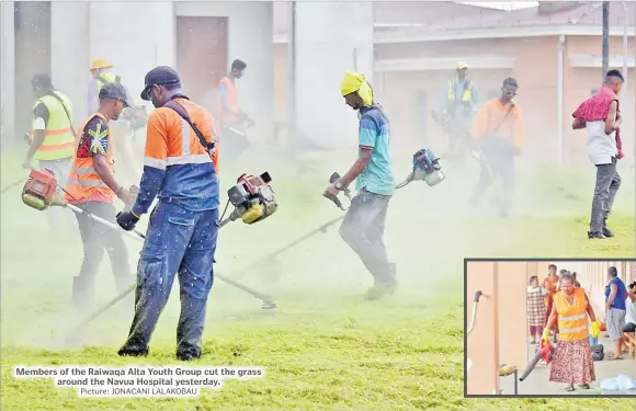  ?? Picture: JONACANI LALAKOBAU ?? Members of the Raiwaqa Alta Youth Group cut the grass around the Navua Hospital yesterday.