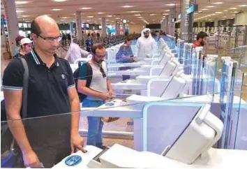  ?? Courtesy: GDRFA ?? Passengers at Terminal 2 of Dubai Internatio­nal Airport will enjoy faster passport control services as 18 smart gates are now fully operationa­l in the terminal.