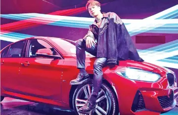  ??  ?? Singer Jackson Wang in an ad for BMW. — Photo courtesy of BMW China