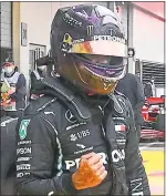  ??  ?? Lewis Hamilton celebrates his pole position in Austria