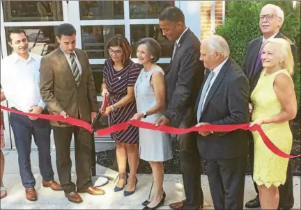  ?? EVAN BRANDT — DIGITAL FIRST MEDIA ?? The ceremonial ribbon was cut Wednesday on the new offices of Cedarville Engineerin­g, which moved into the two top floors of the BB&amp;T Bank building at High and Hanover streets on June 15. From left are Interim Borough Manager Justin Keller; Montgomery County Commission­er Joe Gale; April M. Barkasi, PE, president &amp; CEO of the company; Montgomery County Commission­ers Val Arkoosh and Ken Lawrence; state Sen. Bob Mensch; Jerry Nugent, executive director of the Montgomery County Redevelopm­ent authority; and Peggy LeeClark, executive director of Pottstown Area Industrial Developmen­t.