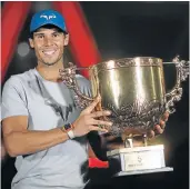  ?? Picture: GETTY IMAGES/LINTAO ZHANG ?? POSTER BOY: Rafael Nadal, of Spain, holds the China Open winners trophy