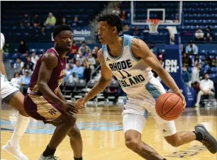  ??  ?? Photo by Michael Derr / The Independen­t
Jeff Dowtin (11) is one of a number of important players who return for a University of Rhode Island men’s basketball team that expects to compete for an NCAA Tournament berth in March.