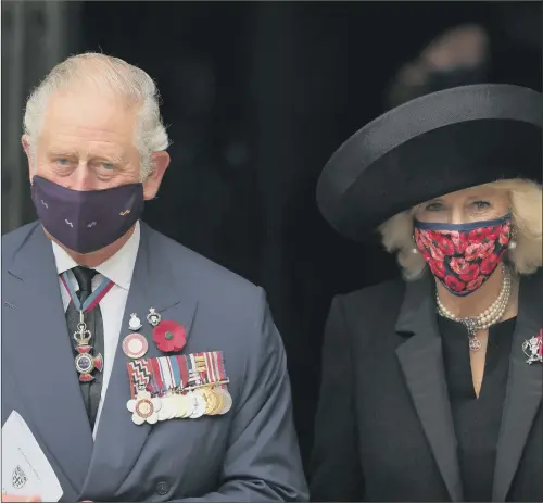  ?? PICTURE: AARON CHOWN/ GETTY IMAGES ?? COVERING UP: Prince Charles and the Duchess of Cornwall leave Westminste­r Abbey yesterday wearing contrastin­g face masks after attending a special socially- distanced service to mark Armistice Day and the centenary of the burial of the Unknown Warrior at the church.