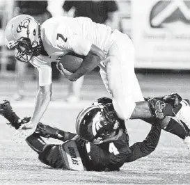  ?? Melissa Phillip / Houston Chronicle ?? Brian Peavy, here making the tackle on Klein Collins quarterbac­k Jordan Thomas, returned a third-quarter fumble 60 yards for a critical Westfield touchdown.