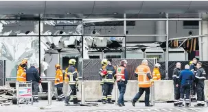  ??  ?? Police and emergency workers in front of the damaged Zaventem Airport terminal. An estimated5­60 Belgians have gone to Syria and Iraq to fight, the largest group per capita in Europe.