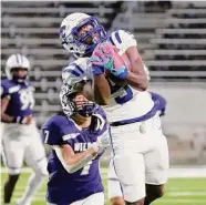  ?? Michael Wyke/Contributo­r ?? Cypress Creek’s Jamon Richardson makes a catch in front of Tomball Memorial’s Colin Helmer.