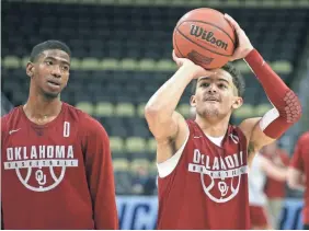  ?? CHARLES LECLAIRE/USA TODAY SPORTS ?? Oklahoma’s Trae Young, right, could give Rhode Island fits with his shooting and passing ability.