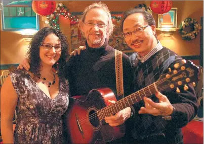  ?? File photos by Ernest A. Brown ?? Jennifer Jolicoeur, of North Smithfield, left, hangs out with Peter Tork, of The Monkees, center, and John Chan, owner of Chan’s Restaurant in Woonsocket, during a benefit event in 2009. The former Monkee died at age 77 on Thursday.