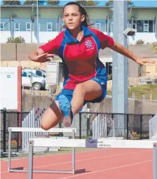  ??  ?? Antonia Djordjevic of Year 9 hits the hurdles.