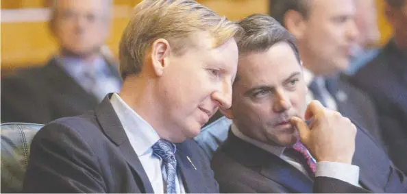  ?? JAMES WEST / THE CANADIAN PRESS FILES ?? New Brunswick Education Minister Dominic Cardy, left, and fellow PC MLA Jake Stewart in the legislatur­e. Cardy raised the alarm on COVID-19 and cabinet took early action.
