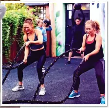  ??  ?? WHIP SMART: Customers at a Strong And Bendy class get to grips with ‘battle ropes’