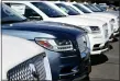  ?? DAVID ZALUBOWSKI — THE ASSOCIATED PRESS FILE ?? Unsold 2019 Lincoln Navigators sit at a dealership in Englewood, Colo.