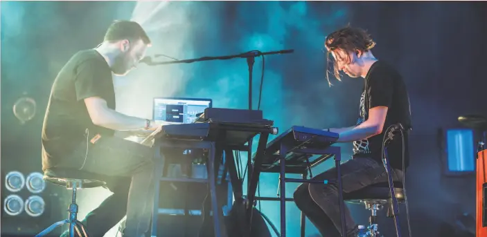  ?? Javier Bragado / WireImage 2019 ?? Barry Burns (left) and Alex Mackay perform with Mogwai at the 2019 Madcool Festival in Madrid. The Scottish band has just released its 10th studio album.