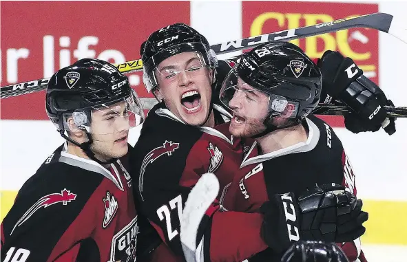  ?? — GETTY IMAGES ?? After a slow start to his WHL career and extended absences due to “upper-body injuries,” Vancouver Giants forward Dawson Holt, left, has been filling the scoresheet on a regular basis with career highs in goals (seven) and points (25) already this...